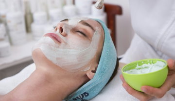 woman-lying-on-blue-towel-with-white-cream-on-face.jpg woman lying on blue towel with white cream on face