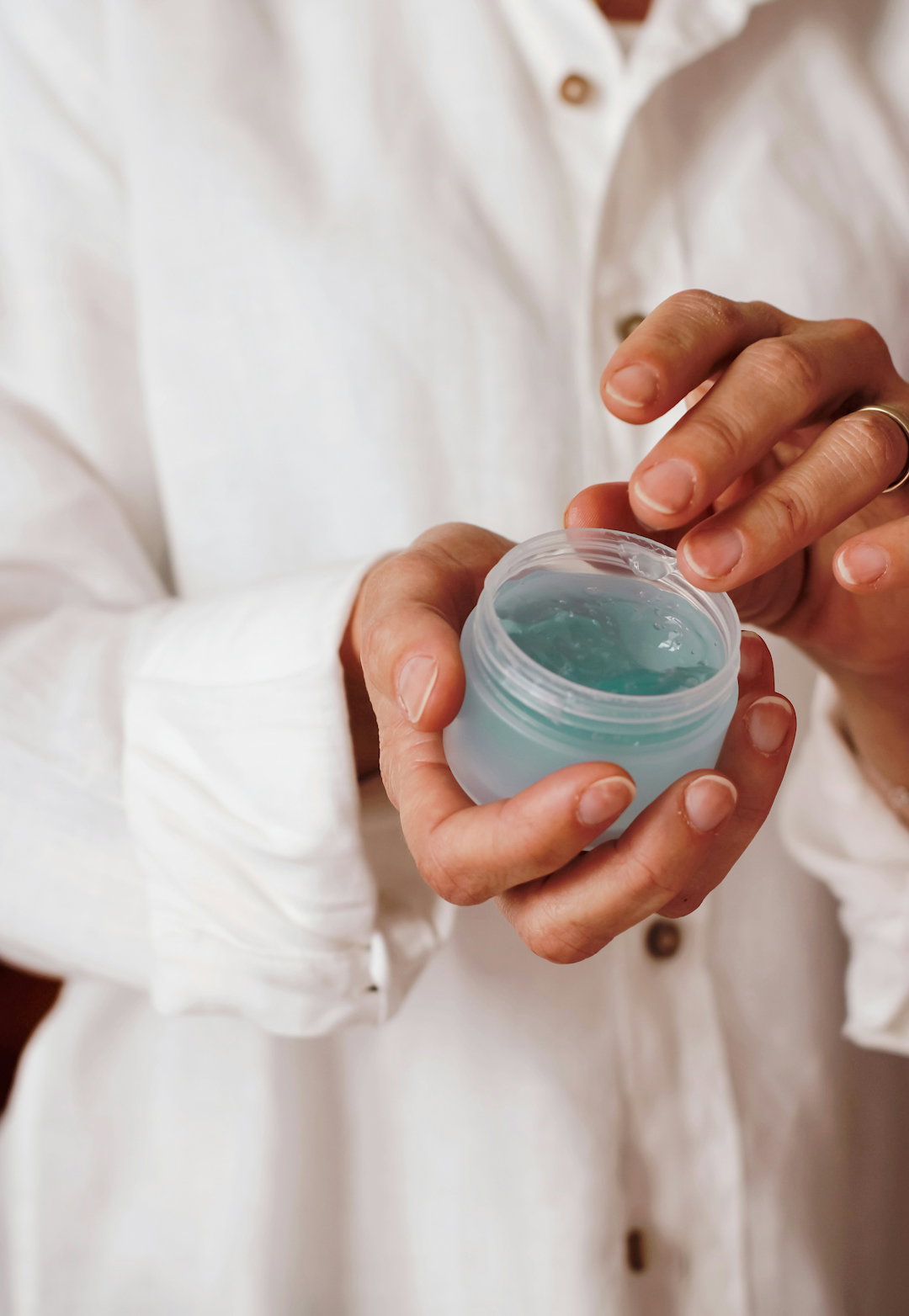person-holding-blue-plastic-container.jpg person holding blue plastic container