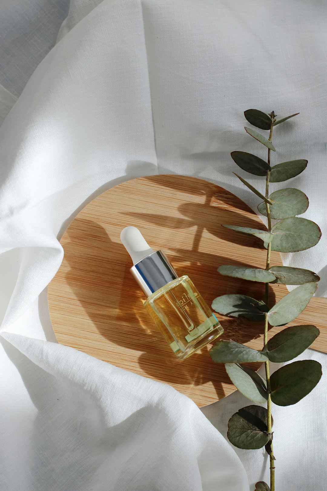 clear-glass-bottle-on-white-textile.jpg clear glass bottle on white textile