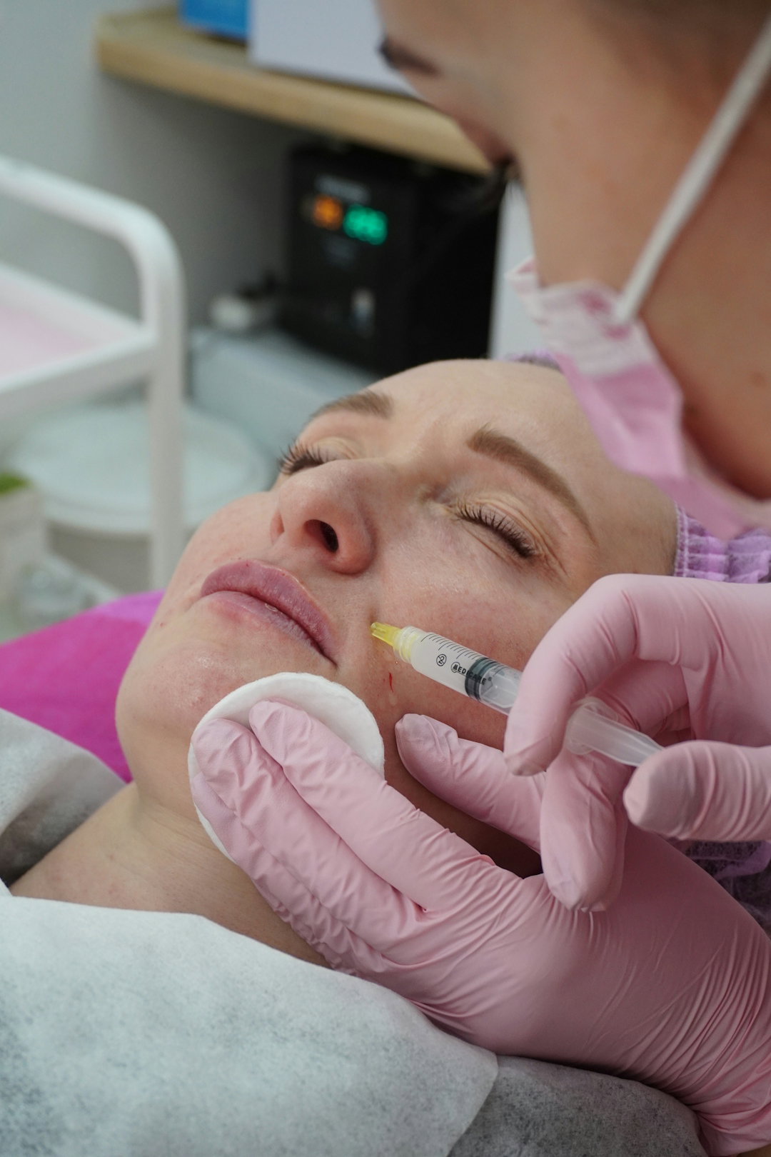 a-woman-getting-her-teeth-checked-by-a-dentist.jpg A woman getting her teeth checked by a dentist